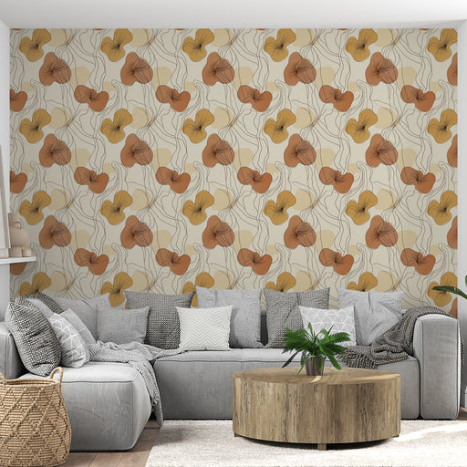 Un salon moderne avec un papier peint floral aux teintes chaudes de jaune et orange, créant une ambiance accueillante et joyeuse.