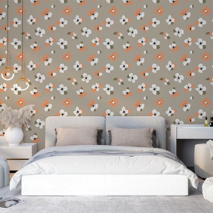 Une chambre moderne avec un papier peint floral aux motifs colorés d'orange et de blanc sur fond beige, créant une atmosphère chaleureuse et accueillante.