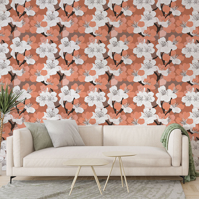 Un salon moderne avec un papier peint floral aux motifs de fleurs blanches et corail sur fond marron, créant une ambiance chaleureuse et accueillante.