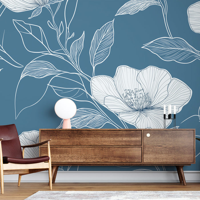 Une pièce moderne avec un papier peint bleu profond orné de motifs floraux blancs délicats, créant une atmosphère à la fois élégante et apaisante.