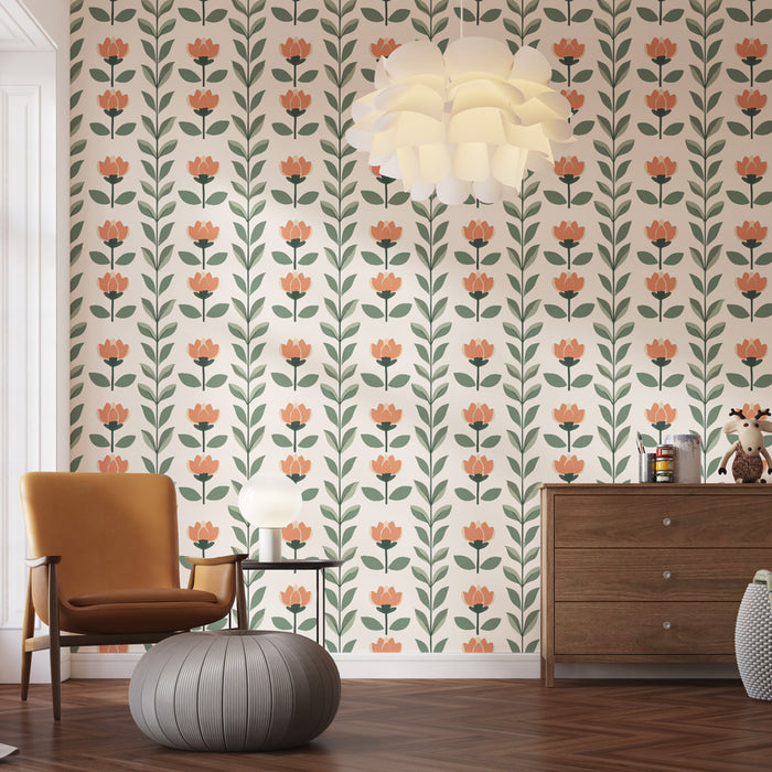 Une chambre lumineuse avec un papier peint floral aux motifs de fleurs roses et vertes sur fond clair, créant une ambiance douce et accueillante.