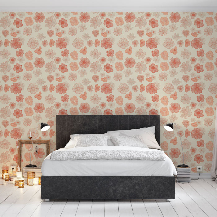 Une chambre moderne avec un papier peint floral aux motifs de fleurs corail sur fond crème, créant une atmosphère douce et chaleureuse.