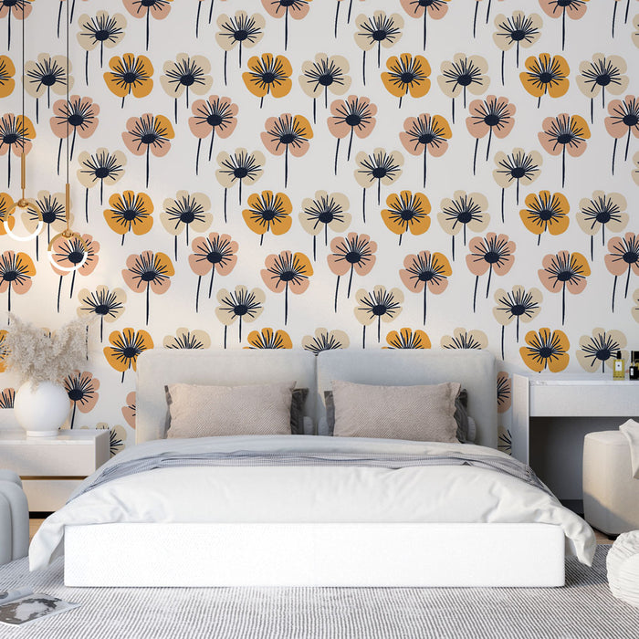 Une chambre lumineuse avec un papier peint floral aux motifs de fleurs stylisées en jaune, rose et noir sur fond clair, créant une ambiance joyeuse et chaleureuse.