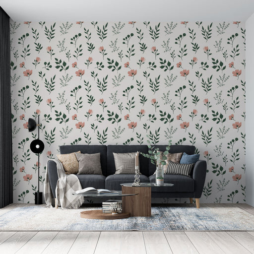 Un salon contemporain avec un papier peint floral aux motifs délicats de fleurs roses et de feuillages verts sur fond clair, créant une atmosphère douce et accueillante.