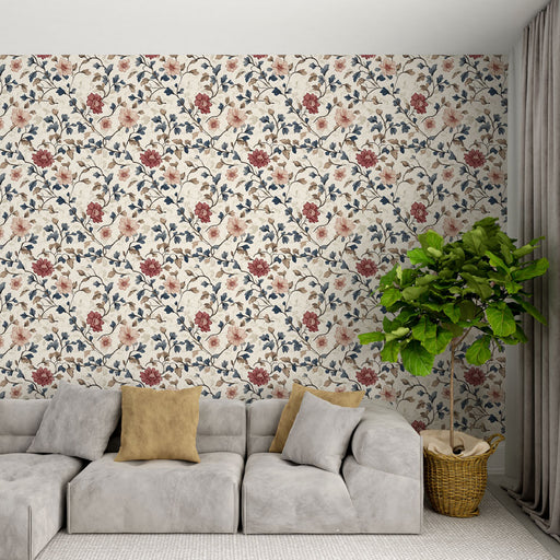 Un salon moderne avec un papier peint floral aux teintes douces de beige, rouge et bleu, créant une ambiance chaleureuse et accueillante.