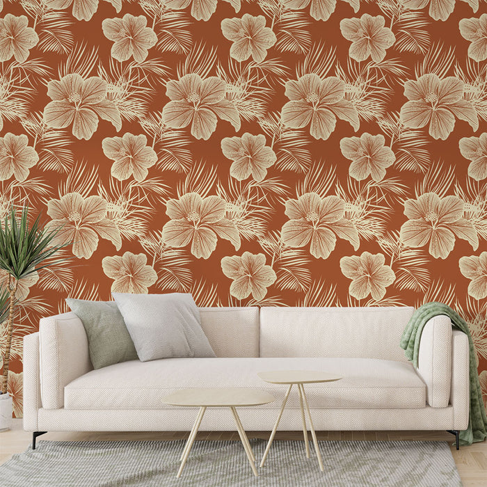 Un salon lumineux avec un papier peint floral aux grandes fleurs crème sur fond terracotta, créant une ambiance chaleureuse et tropicale.