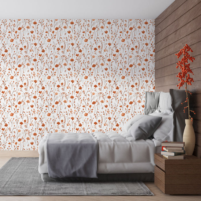 Une chambre moderne avec un papier peint floral aux motifs orange et blancs sur fond clair, créant une atmosphère chaleureuse et accueillante.
