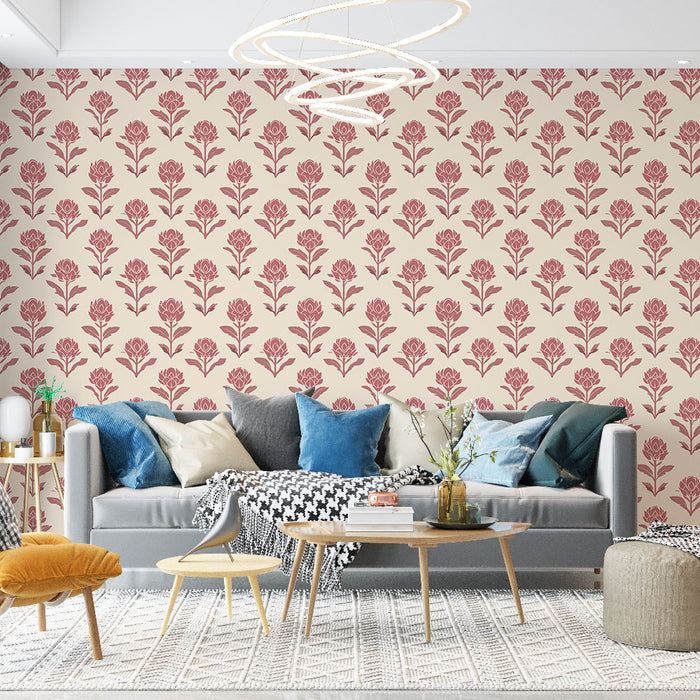 Un salon moderne avec un papier peint floral crème et rouge aux motifs de fleurs stylisées, créant une atmosphère chaleureuse et accueillante.