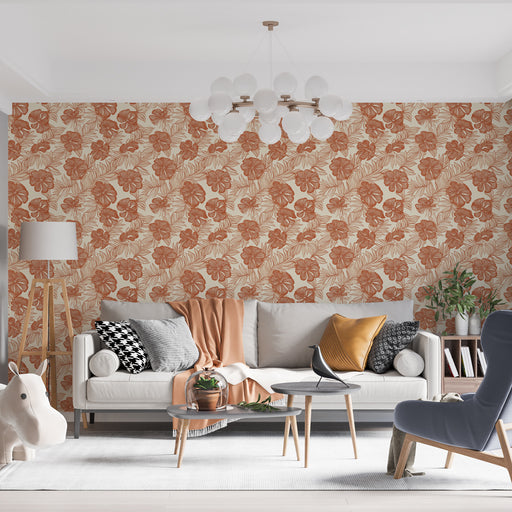 Un salon contemporain avec un papier peint floral aux teintes terracotta et crème, créant une ambiance chaleureuse et accueillante.
