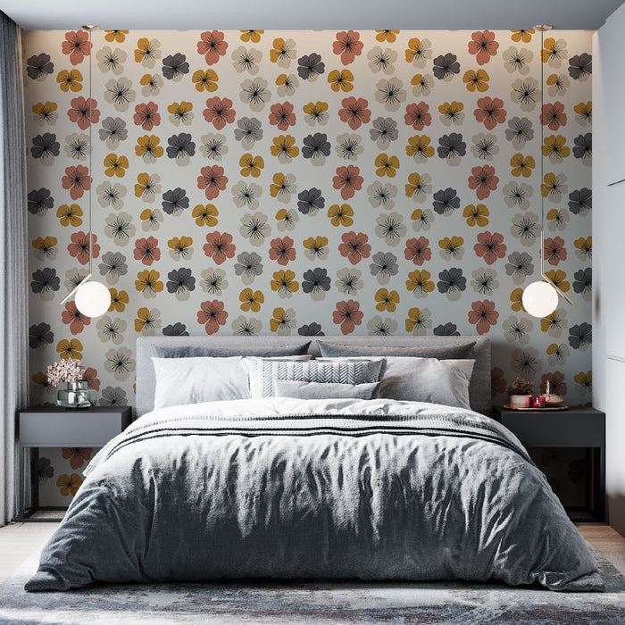 Une chambre moderne avec un papier peint floral aux teintes douces de rose, jaune et noir, créant une ambiance chaleureuse et accueillante.