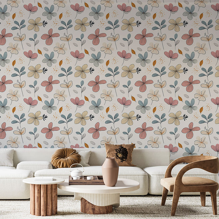 Un salon lumineux avec un papier peint floral aux teintes douces de rose, bleu et jaune, créant une atmosphère chaleureuse et accueillante.