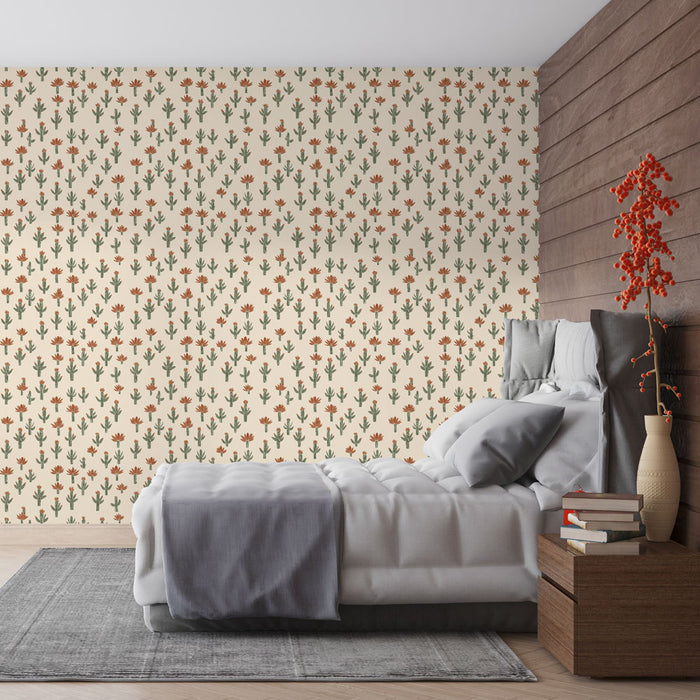 Une chambre accueillante avec un papier peint floral beige orné de motifs de cactus et de fleurs rouges, créant une atmosphère chaleureuse et naturelle.
