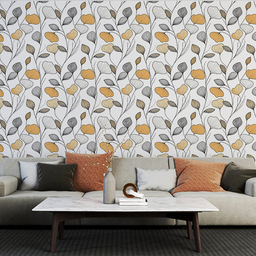 Un salon moderne avec un papier peint floral aux motifs délicats de fleurs jaunes et grises sur fond blanc, créant une ambiance chaleureuse et accueillante.