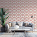 Un salon moderne avec un papier peint floral rose délicat, orné de motifs blancs et dorés évoquant une ambiance douce et élégante.