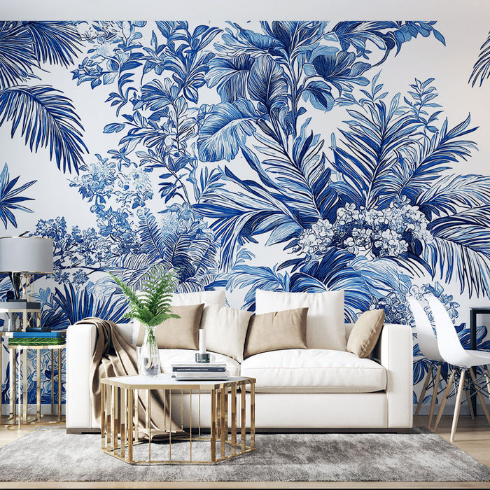 Un salon moderne avec un papier peint tropical bleu et blanc représentant de grandes feuilles exotiques et des fleurs, créant une atmosphère fraîche et apaisante.