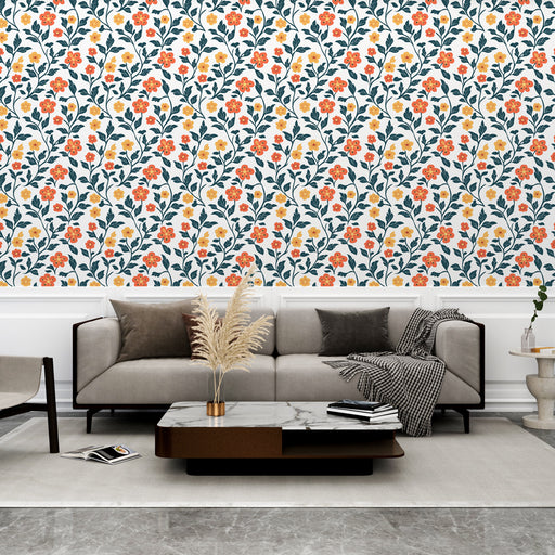 Un salon moderne avec un papier peint floral aux motifs colorés de fleurs rouges et jaunes sur fond blanc, créant une ambiance chaleureuse et accueillante.