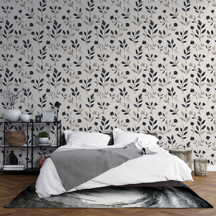 Une chambre moderne avec un papier peint floral aux motifs délicats de feuilles et fleurs noires sur fond clair, créant une atmosphère apaisante et élégante.