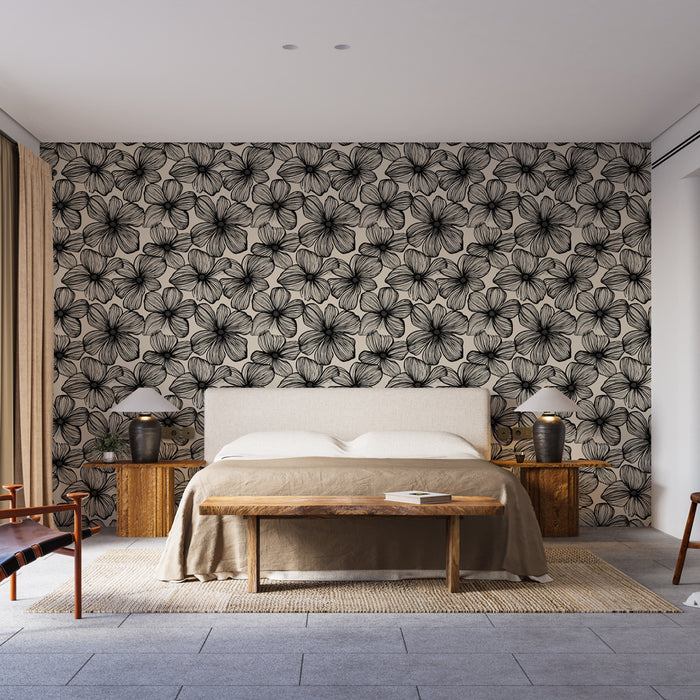 Une chambre moderne avec un papier peint floral noir sur fond beige, créant une ambiance élégante et apaisante.