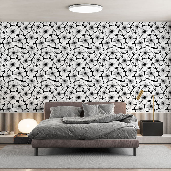 Une chambre moderne avec un papier peint floral noir et blanc aux motifs élégants, créant une atmosphère à la fois chic et apaisante.