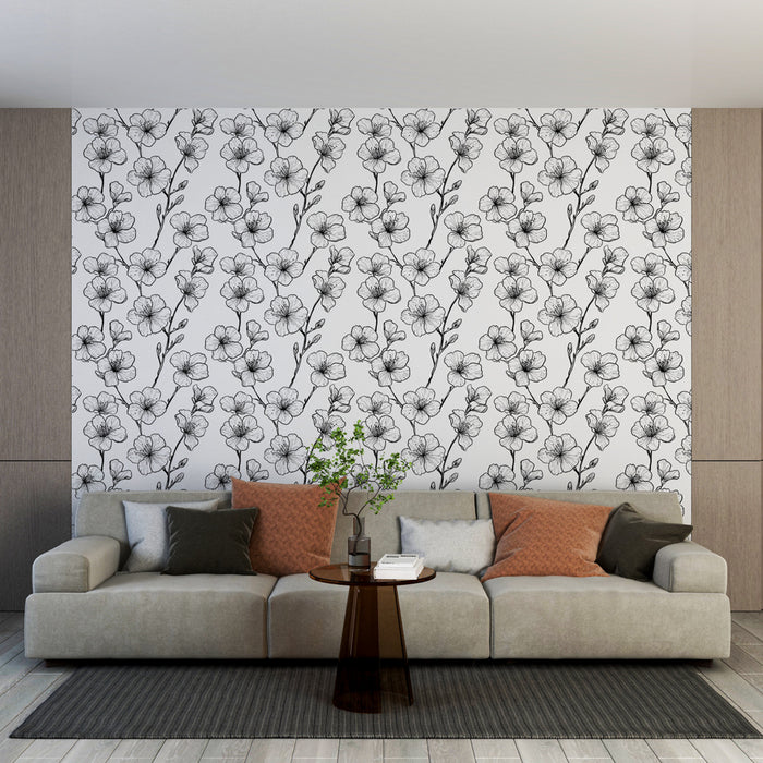 Un salon moderne avec un papier peint floral en noir et blanc, présentant des motifs délicats de fleurs, créant une ambiance élégante et apaisante.