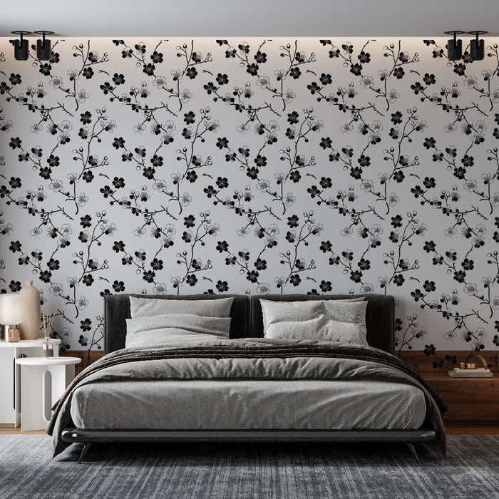 Une chambre moderne avec un papier peint floral noir et blanc, présentant des motifs élégants de fleurs sur fond clair, créant une atmosphère chic et apaisante.