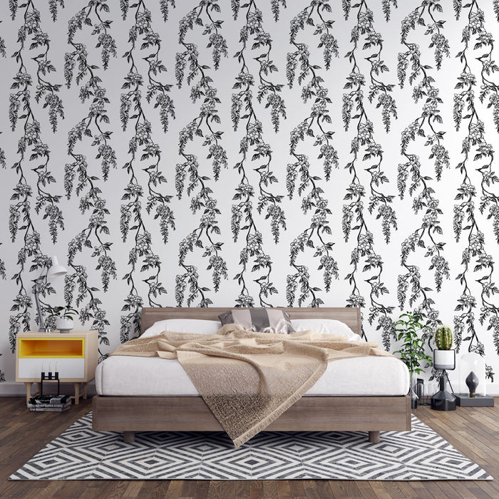 Une chambre moderne avec un papier peint floral noir et blanc représentant des branches délicates, créant une atmosphère élégante et apaisante.
