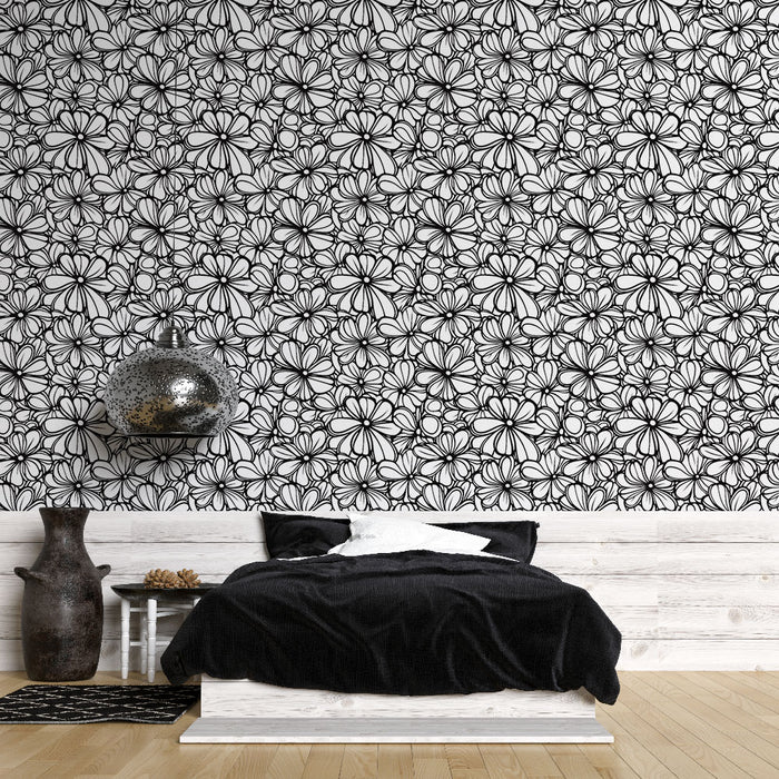 Une chambre moderne avec un papier peint floral noir et blanc aux motifs délicats, créant une ambiance artistique et élégante.