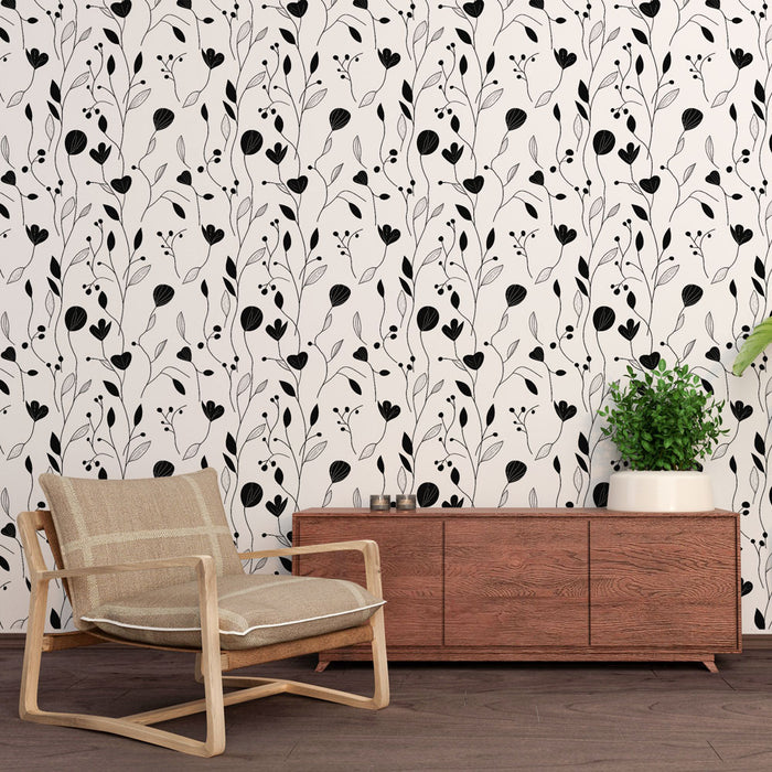 Une pièce moderne avec un papier peint floral noir et blanc aux motifs délicats de plantes, créant une atmosphère élégante et apaisante.