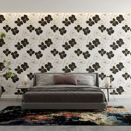 Une chambre élégante avec un papier peint floral noir et blanc aux motifs raffinés, créant une atmosphère moderne et artistique.