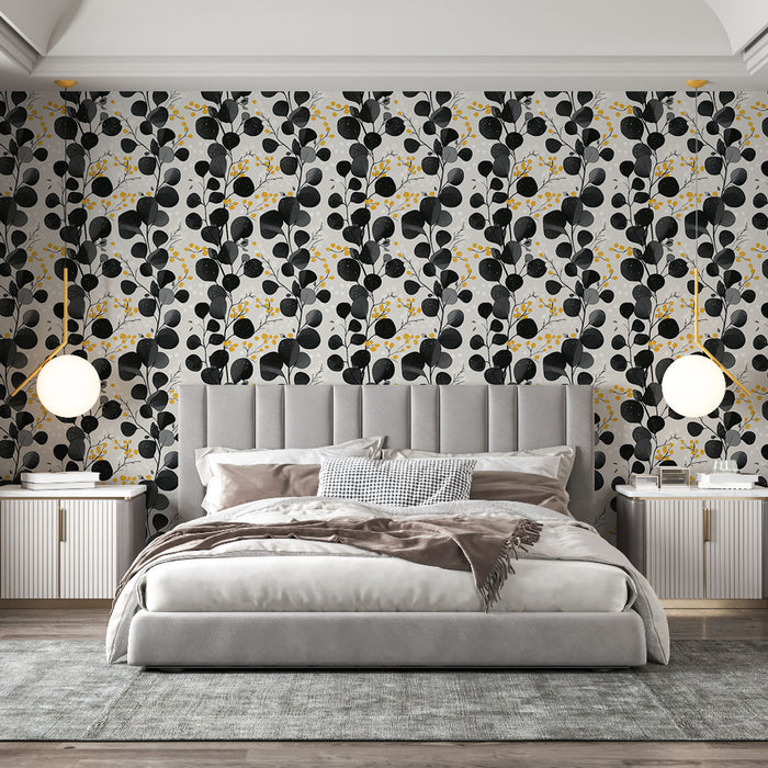 Une chambre élégante avec un papier peint floral noir et jaune sur fond clair, créant une ambiance moderne et chaleureuse.