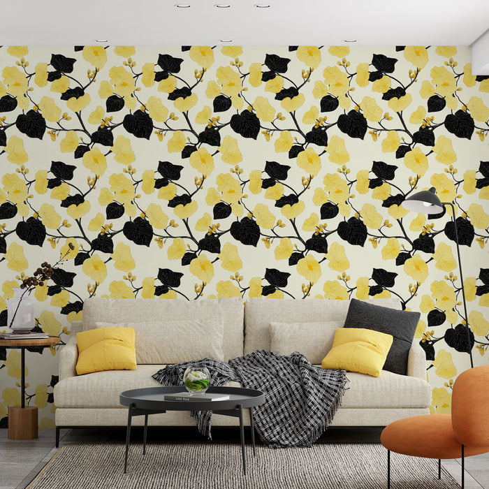 Un salon moderne avec un papier peint floral jaune et noir représentant des branches ornées de fleurs et de feuilles, créant une ambiance dynamique et chaleureuse.