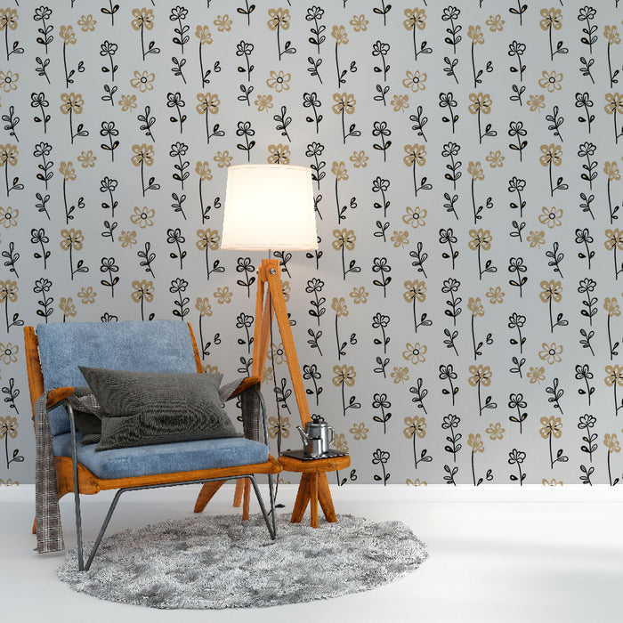 Une pièce moderne avec un papier peint floral aux motifs délicats en noir et or sur fond clair, créant une ambiance douce et accueillante.
