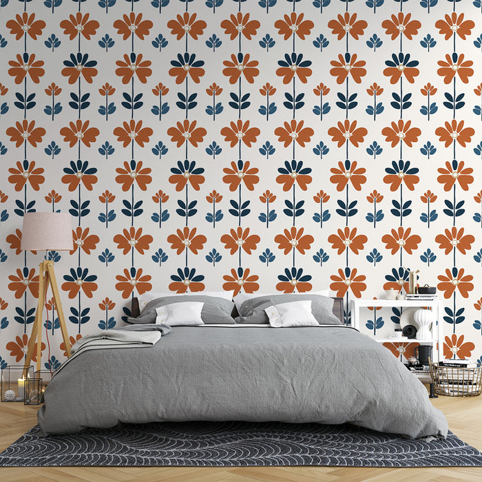 Une chambre moderne avec un papier peint floral aux motifs orange et bleu sur fond blanc, créant une ambiance chaleureuse et accueillante.