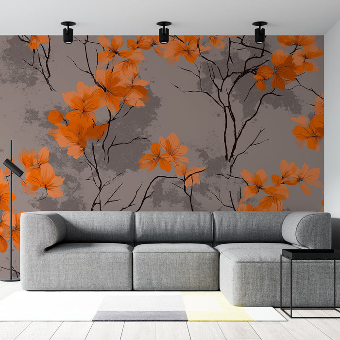 Un salon contemporain avec un papier peint floral aux grandes fleurs orange sur fond gris, créant une atmosphère chaleureuse et accueillante.