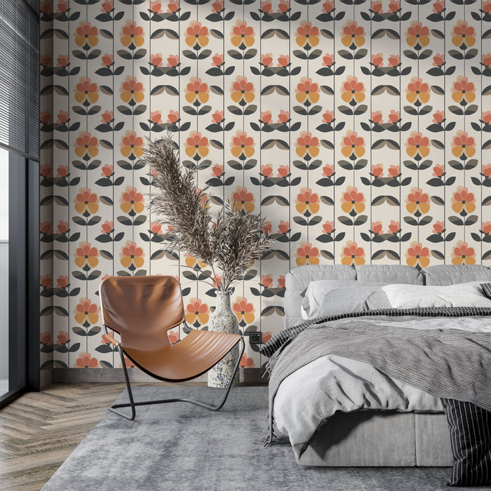 Une chambre moderne avec un papier peint rétro aux motifs floraux orange et noir sur fond crème, créant une ambiance chaleureuse et artistique.