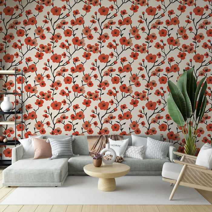 Un salon moderne avec un papier peint floral aux motifs de fleurs rouges sur fond beige, créant une atmosphère chaleureuse et accueillante.