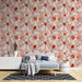 Une chambre moderne avec un papier peint floral aux teintes chaudes de rouge et beige, créant une atmosphère accueillante et élégante.