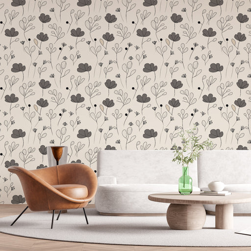 Un salon moderne avec un papier peint floral beige et noir, aux motifs délicats de fleurs stylisées, créant une ambiance douce et élégante.