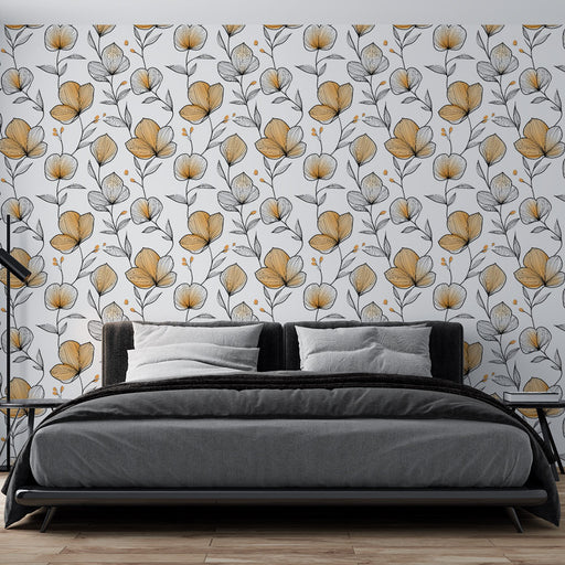 Une chambre moderne avec un papier peint floral aux motifs jaunes et noirs sur fond blanc, créant une ambiance douce et accueillante.