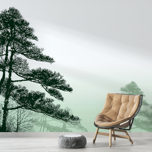 Une chambre moderne avec un papier peint représentant des silhouettes d’arbres en vert foncé sur un dégradé apaisant de vert clair, créant une ambiance naturelle et sereine.