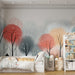 Une chambre d'enfant avec un papier peint illustrant des arbres aux teintes pastel, créant une atmosphère douce et apaisante, idéale pour le repos.