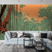 Un salon moderne avec un papier peint illustrant une forêt stylisée aux teintes vertes et orangées, créant une atmosphère apaisante et naturelle.