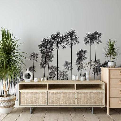 Une pièce moderne avec un papier peint représentant des silhouettes de palmiers noirs sur fond clair, créant une ambiance à la fois élégante et apaisante.