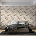Une chambre moderne avec un papier peint aux motifs de galets dans des teintes beige et marron, créant une ambiance chaleureuse et apaisante.