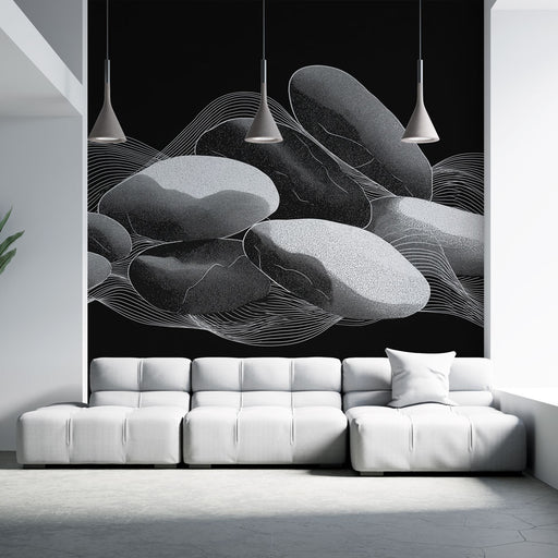 Un salon contemporain avec un papier peint représentant des galets en nuances de noir et blanc, créant une ambiance zen et apaisante.
