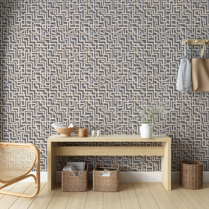 Une pièce moderne avec un papier peint géométrique aux motifs en relief beige et gris, créant une ambiance dynamique et élégante.