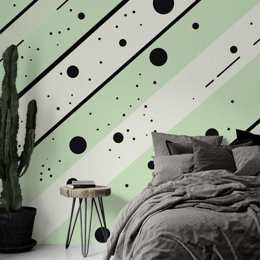 Papier peint géométrique vert pastel avec cercles et taches noires pour chambre moderne