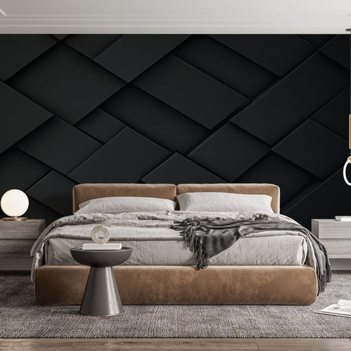 Une chambre moderne avec un papier peint texturé noir en relief, créant une ambiance élégante et sophistiquée.