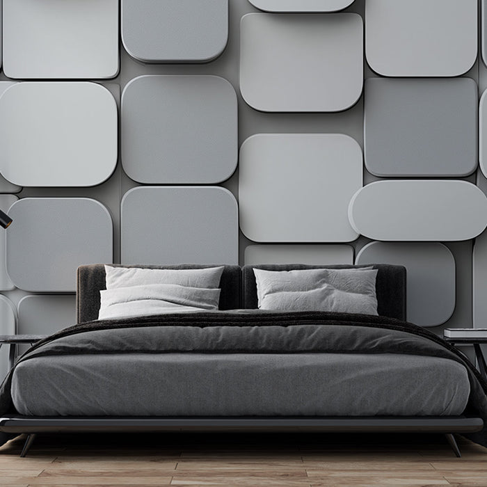 Une chambre moderne avec un papier peint texturé en relief aux formes géométriques grises créant une ambiance élégante et contemporaine.