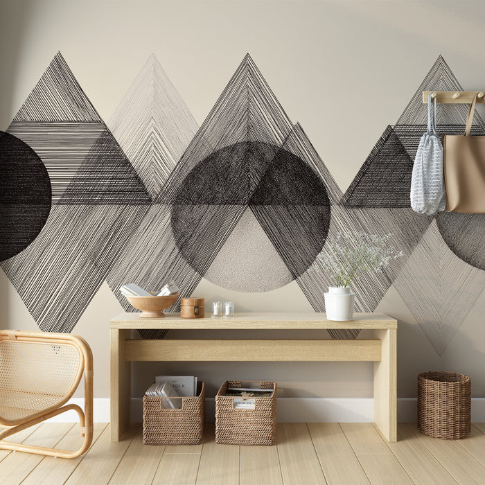 Une entrée moderne avec un papier peint géométrique en noir et blanc, mêlant triangles et cercles, créant une ambiance artistique et contemporaine.
